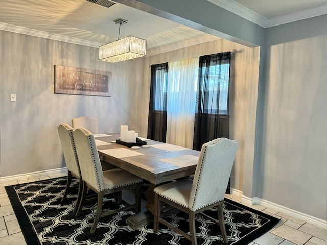 dining area featuring crown molding and an inviting chandelier