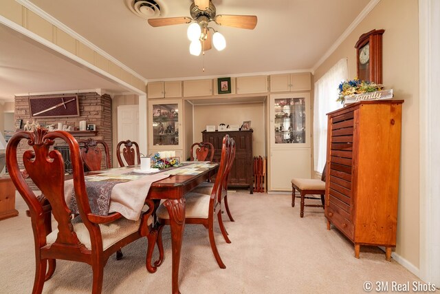 2185 Hillside, San Angelo, TX 76904 - dining space with a ceiling fan, visible vents, crown molding, and light colored carpet