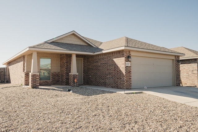 single story home with brick siding, concrete driveway, an attached garage, and a shingled roof