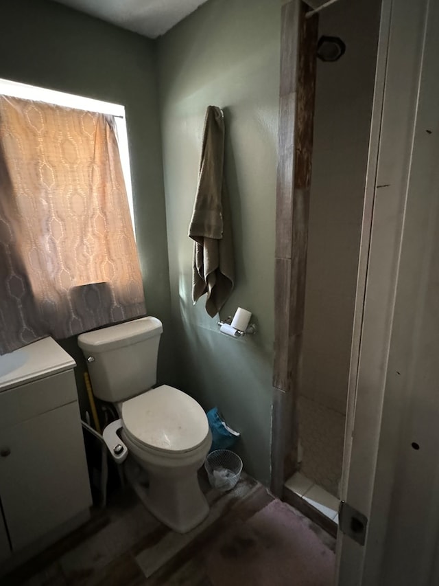 bathroom with toilet and a shower stall