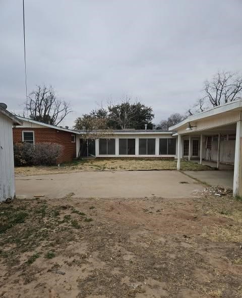 back of house with a sunroom