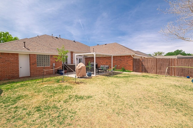 5706 Devlin Pl, Midland, TX 79707 - back of house with a pergola, brick siding, a patio area, and a shingled roof