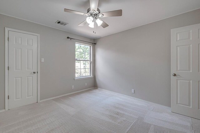 5706 Devlin Pl, Midland, TX 79707 - unfurnished room featuring a ceiling fan, light colored carpet, and baseboards