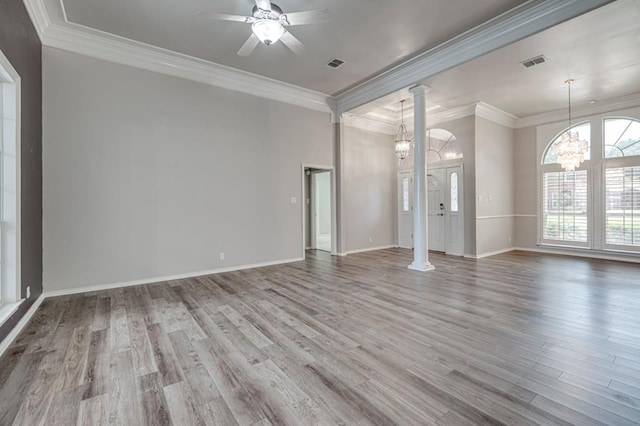 5706 Devlin Pl, Midland, TX 79707 - unfurnished living room featuring wood finished floors, a ceiling fan, crown molding, ornate columns, and baseboards