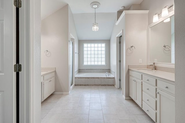 5706 Devlin Pl, Midland, TX 79707 - bathroom featuring vanity, a garden tub, a stall shower, baseboards, and tile patterned floors