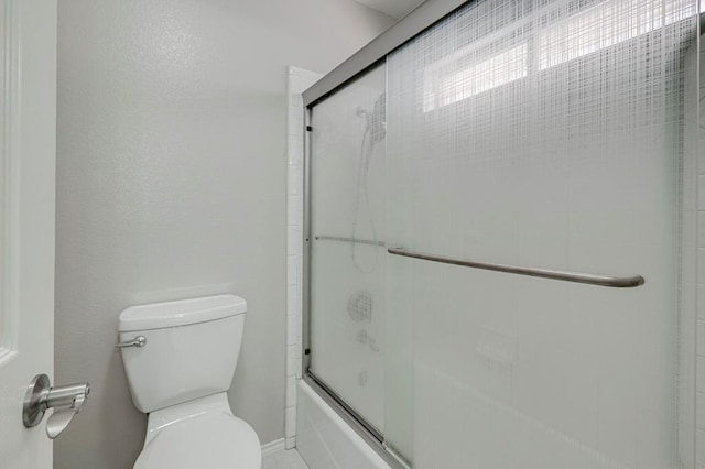5706 Devlin Pl, Midland, TX 79707 - bathroom with toilet and combined bath / shower with glass door