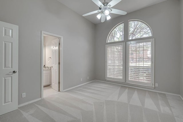 5706 Devlin Pl, Midland, TX 79707 - unfurnished bedroom with light carpet, baseboards, and lofted ceiling