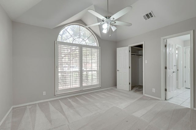 5706 Devlin Pl, Midland, TX 79707 - unfurnished bedroom featuring carpet floors, vaulted ceiling, baseboards, a spacious closet, and ensuite bath