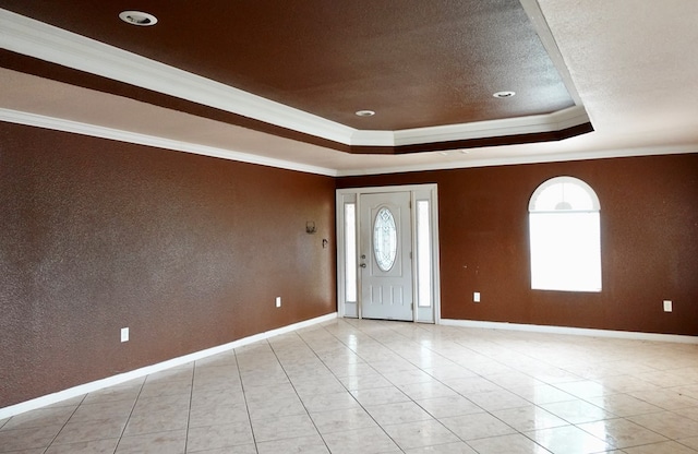 entrance foyer with baseboards, a raised ceiling, ornamental molding, light tile patterned flooring, and recessed lighting