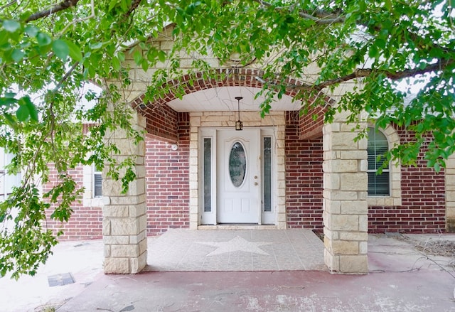 entrance to property with brick siding