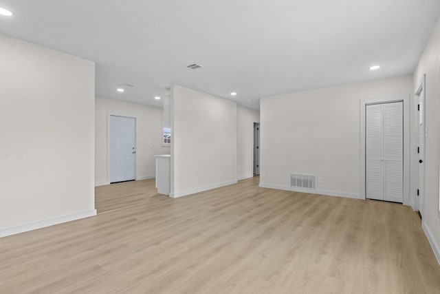 201 E Pine Ave, Midland, TX 79705 - unfurnished living room with light wood-style floors, recessed lighting, and visible vents