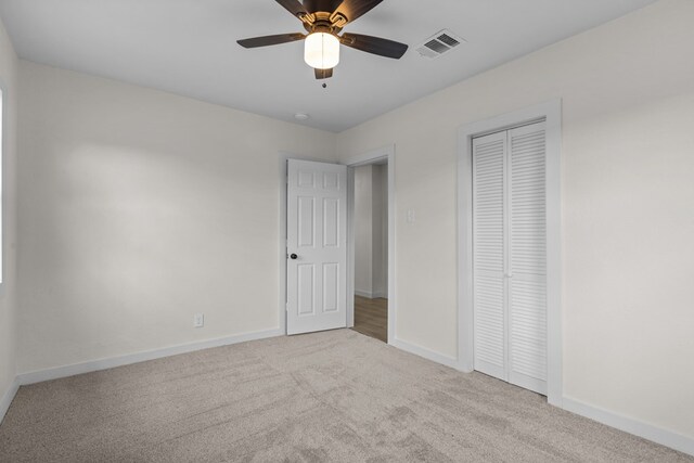 201 E Pine Ave, Midland, TX 79705 - unfurnished bedroom featuring a closet, baseboards, visible vents, and carpet floors