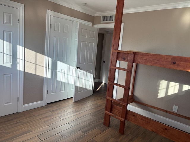 foyer featuring crown molding