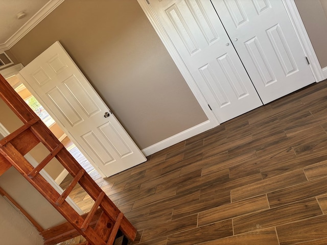 interior space with crown molding and hardwood / wood-style floors