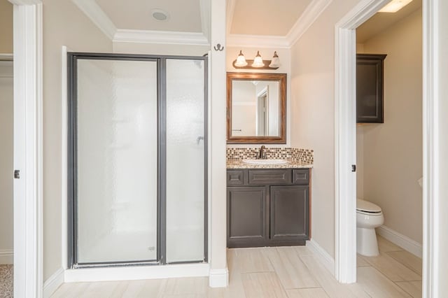 bathroom featuring vanity, backsplash, a shower stall, and toilet