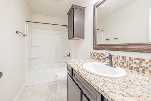 full bath with toilet, vanity, shower / bathing tub combination, backsplash, and tile patterned floors