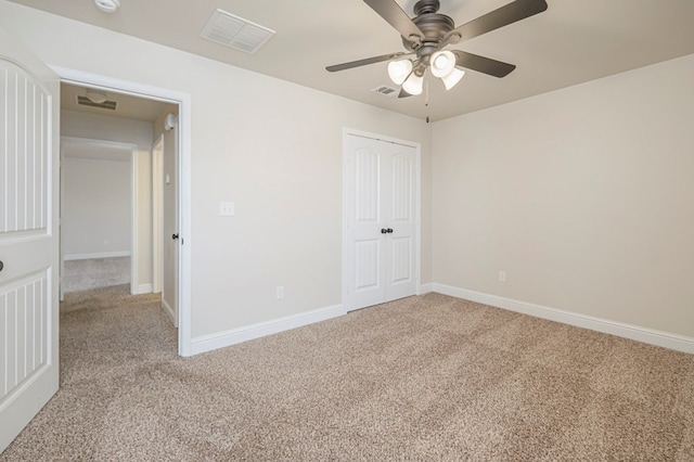 unfurnished bedroom featuring light carpet, baseboards, and visible vents