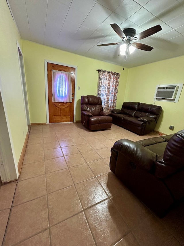 tiled living room featuring ceiling fan and an AC wall unit