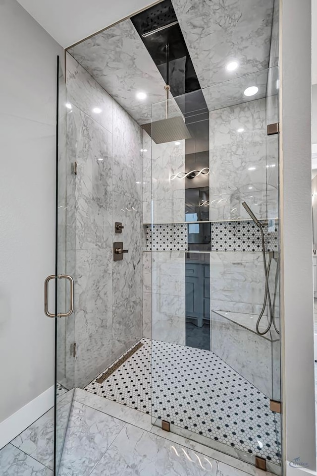 2102 S County Rd 1059, Midland, TX 79706 - bathroom with marble finish floor, a shower stall, and baseboards