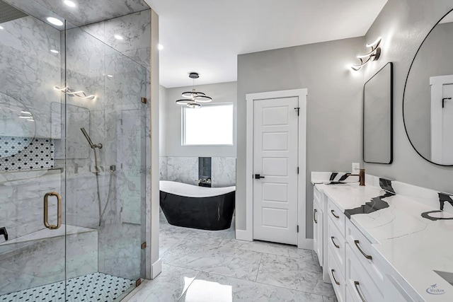 2102 S County Rd 1059, Midland, TX 79706 - bathroom with a freestanding bath, a marble finish shower, marble finish floor, and vanity