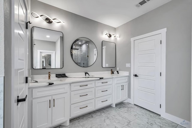 2102 S County Rd 1059, Midland, TX 79706 - bathroom with walk in shower, double vanity, marble finish floor, a sink, and visible vents