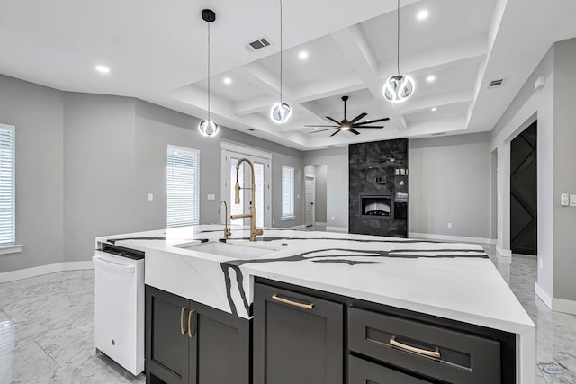 2102 S County Rd 1059, Midland, TX 79706 - kitchen featuring a sink, ceiling fan, coffered ceiling, recessed lighting, and a center island with sink