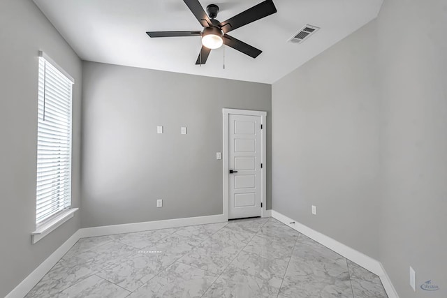 2102 S County Rd 1059, Midland, TX 79706 - empty room featuring marble finish floor, visible vents, and baseboards