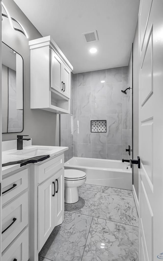 2102 S County Rd 1059, Midland, TX 79706 - bathroom with visible vents, toilet, shower / bathing tub combination, vanity, and marble finish floor