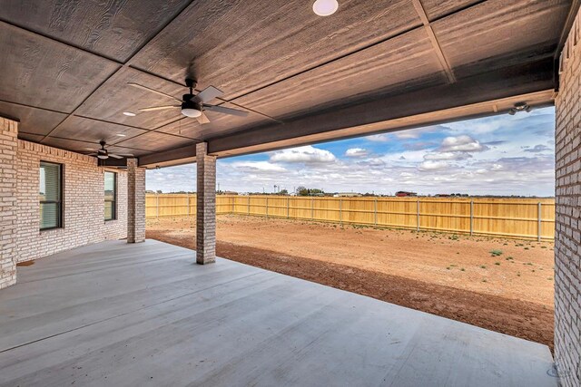 2102 S County Rd 1059, Midland, TX 79706 - wooden terrace featuring a patio, ceiling fan, and a fenced backyard