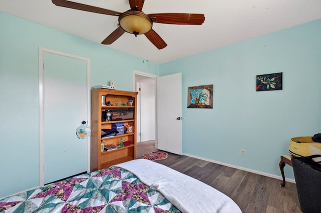 3811 Cimmaron Ave, Midland, TX 79707 - bedroom featuring wood finished floors, ceiling fan, and baseboards