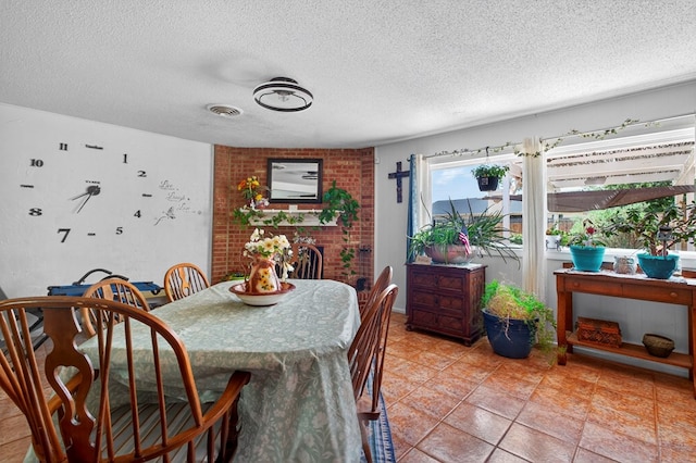 3811 Cimmaron Ave, Midland, TX 79707 - dining room featuring a textured ceiling and light tile patterned floors