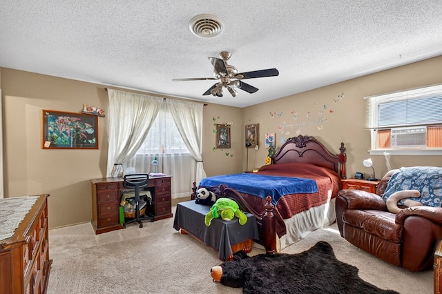 3811 Cimmaron Ave, Midland, TX 79707 - bedroom featuring cooling unit, light carpet, a textured ceiling, and a ceiling fan