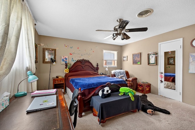 3811 Cimmaron Ave, Midland, TX 79707 - bedroom with a textured ceiling, carpet floors, and ceiling fan