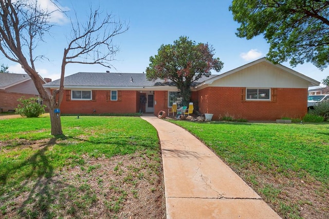 3811 Cimmaron Ave, Midland, TX 79707 - ranch-style home featuring brick siding and a front lawn