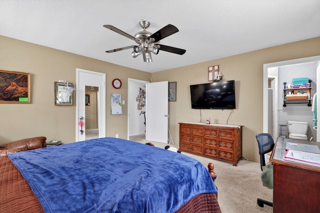 3811 Cimmaron Ave, Midland, TX 79707 - carpeted bedroom featuring a ceiling fan and connected bathroom