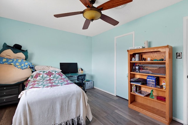 3811 Cimmaron Ave, Midland, TX 79707 - bedroom featuring wood finished floors, baseboards, and a ceiling fan