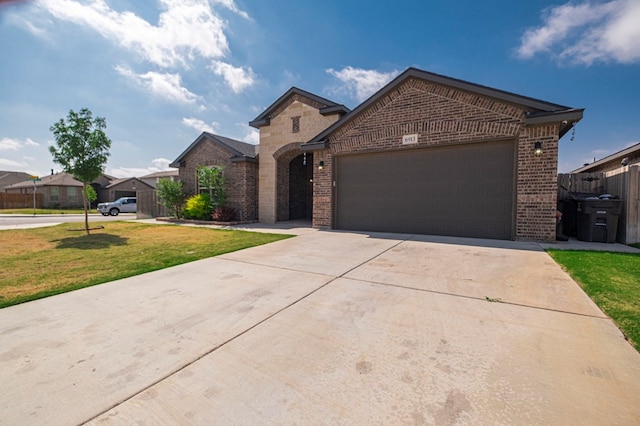 6913 Mcpherson Ln, Midland, TX 79706 - view of front facade featuring brick siding, a garage, and concrete driveway
