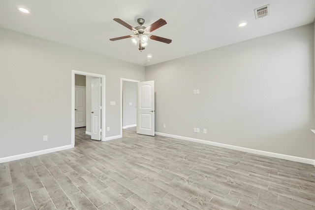 6913 Mcpherson Ln, Midland, TX 79706 - unfurnished bedroom featuring light wood-style floors, baseboards, recessed lighting, and a ceiling fan