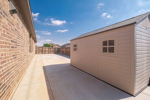 6913 Mcpherson Ln, Midland, TX 79706 - view of side of home featuring a patio area
