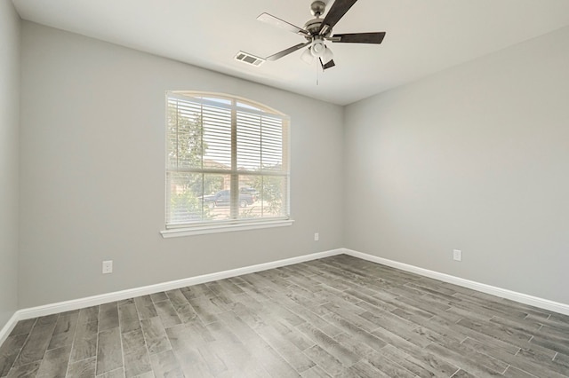 6913 Mcpherson Ln, Midland, TX 79706 - empty room featuring wood finished floors, a ceiling fan, and baseboards