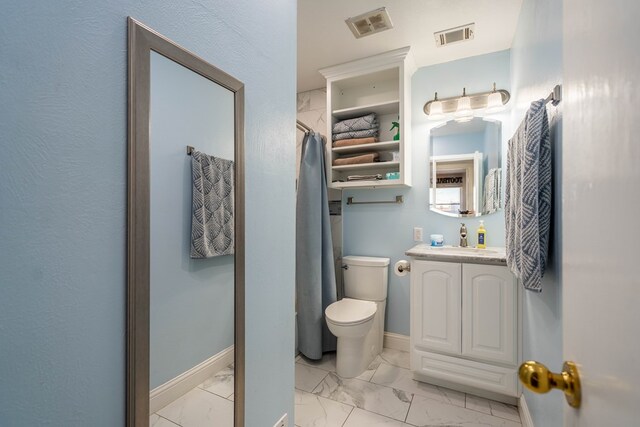 bathroom featuring toilet, baseboards, visible vents, and marble finish floor