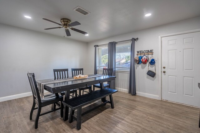 dining area featuring a ceiling fan, visible vents, wood finished floors, baseboards, and recessed lighting
