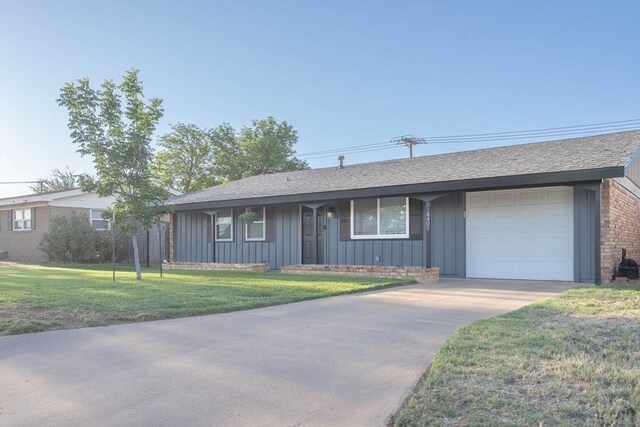 ranch-style house featuring board and batten siding, driveway, roof with shingles, a front yard, and a garage