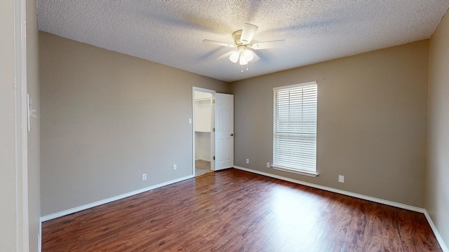 3304 Claremont Dr, Midland, TX 79707 - empty room with ceiling fan, dark wood-type flooring, baseboards, and a textured ceiling