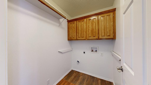 3304 Claremont Dr, Midland, TX 79707 - washroom featuring washer hookup, hookup for an electric dryer, dark wood finished floors, baseboards, and cabinet space