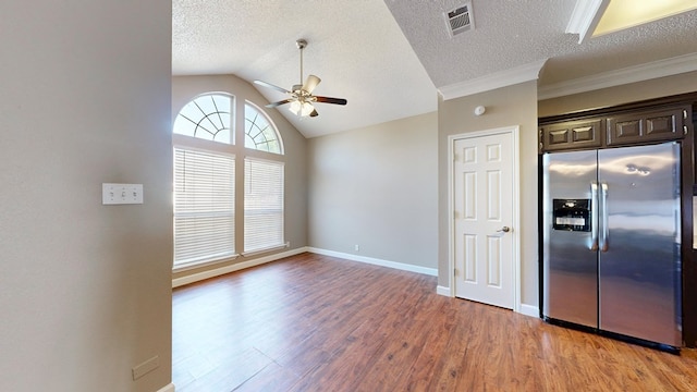 3304 Claremont Dr, Midland, TX 79707 - kitchen with stainless steel refrigerator with ice dispenser, ceiling fan, light wood-type flooring, a textured ceiling, and dark brown cabinetry