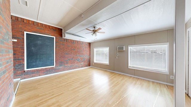 3304 Claremont Dr, Midland, TX 79707 - empty room featuring a ceiling fan, wood finished floors, brick wall, baseboards, and beamed ceiling
