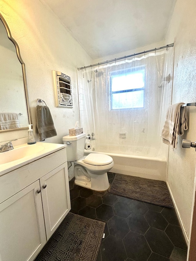 full bathroom with shower / tub combo with curtain, vanity, and toilet