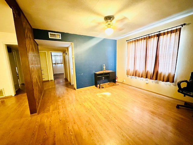 interior space with hardwood / wood-style flooring and ceiling fan