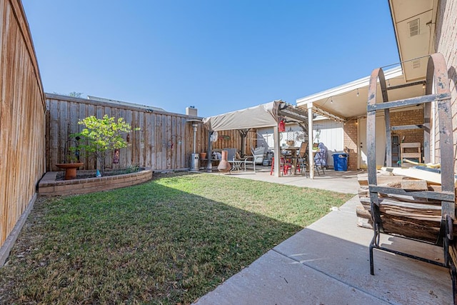 view of yard featuring a patio area and a fenced backyard